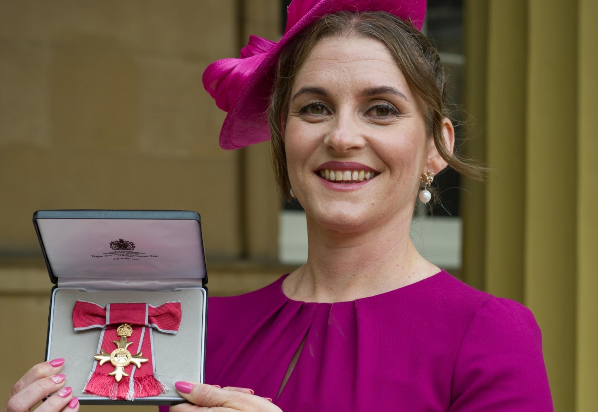 Ruth Busby with her OBE